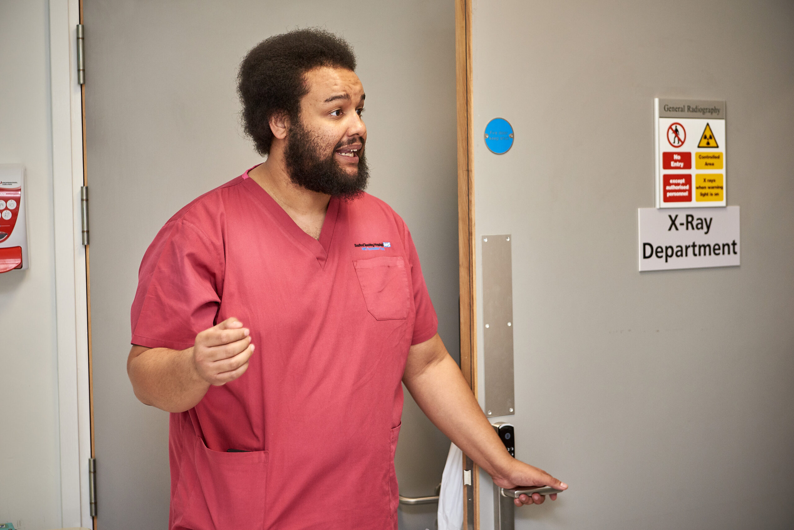Picture of radiologist in red scrubs.