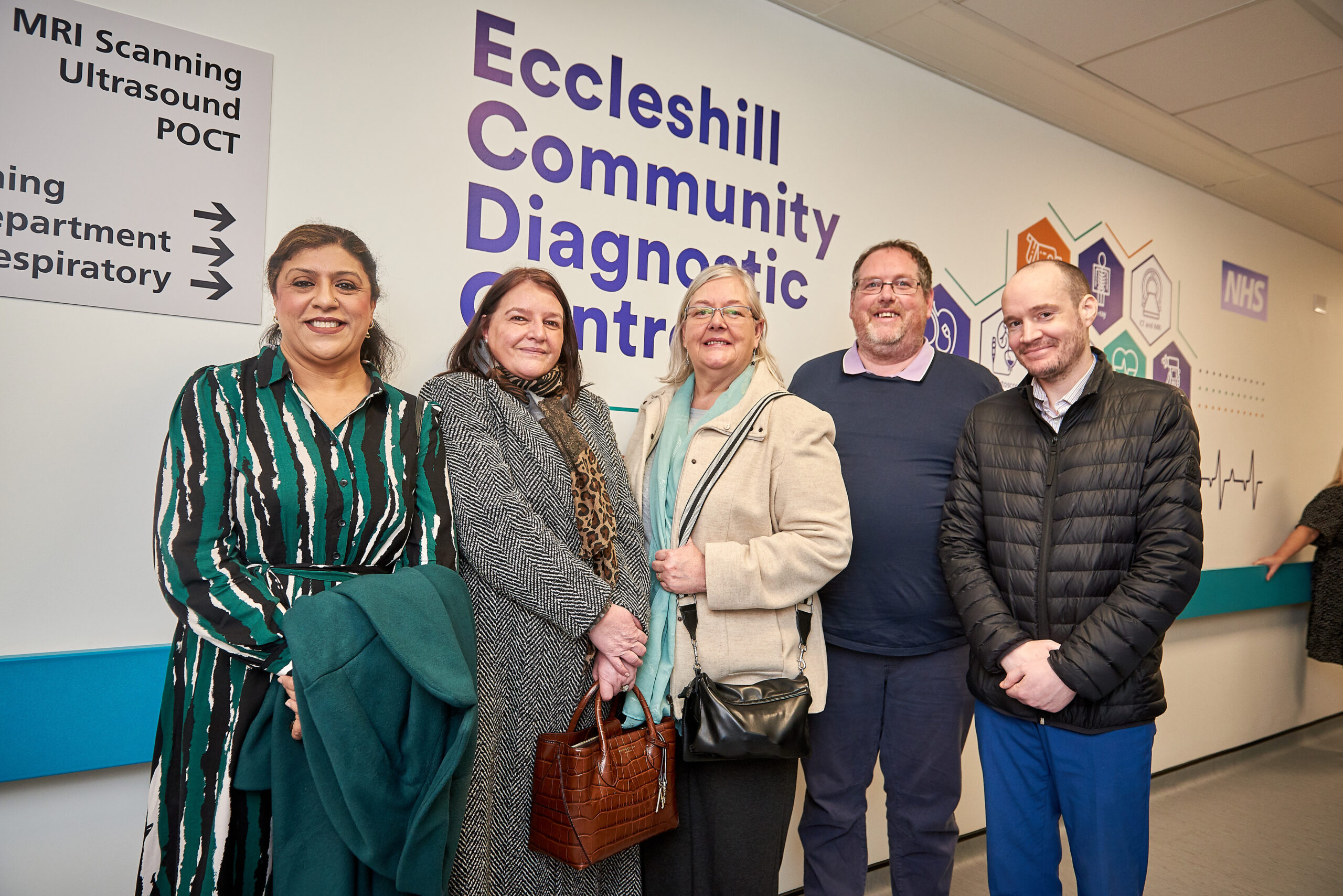 Picture of five people in front of Eccleshill Community Diagnostic Centre sign.
