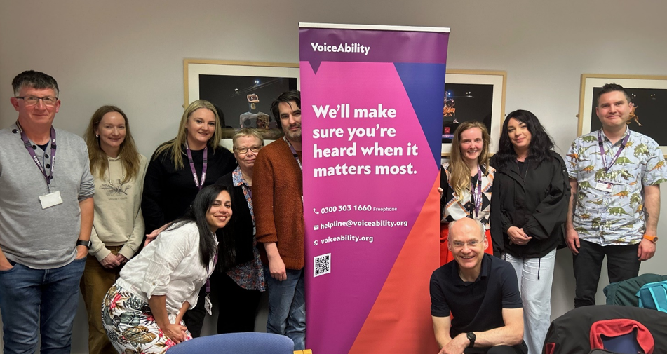 VoiceAbility’s Bradford team, pictured with Chief Executive Richard Jones (kneeling down, third from right), is continuing to support Bradford people to be heard in decisions about their health, care and wellbeing under a new contract. Photo credit: VoiceAbility