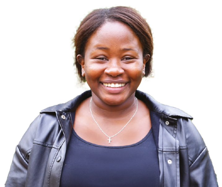 Smiling woman wearing a black leather jacket and cross necklace