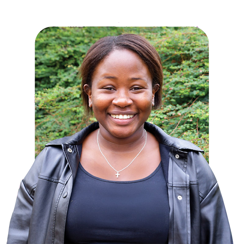 Young woman smiling outdoors, wearing a black top and leather jacket, sharing her cervical screening story